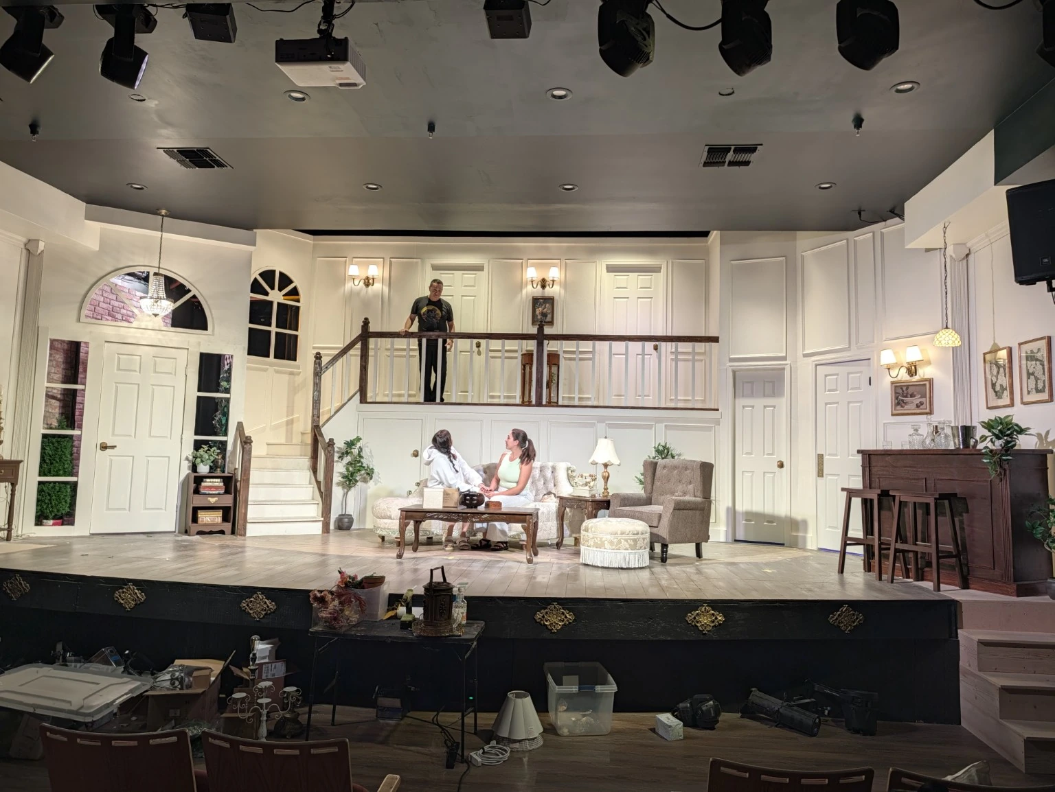 Original cream-colored Banzerini House stage with stairs and balcony